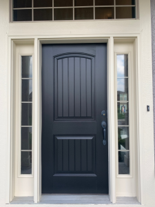 Charcoal front door with repainted white sidelights and trim